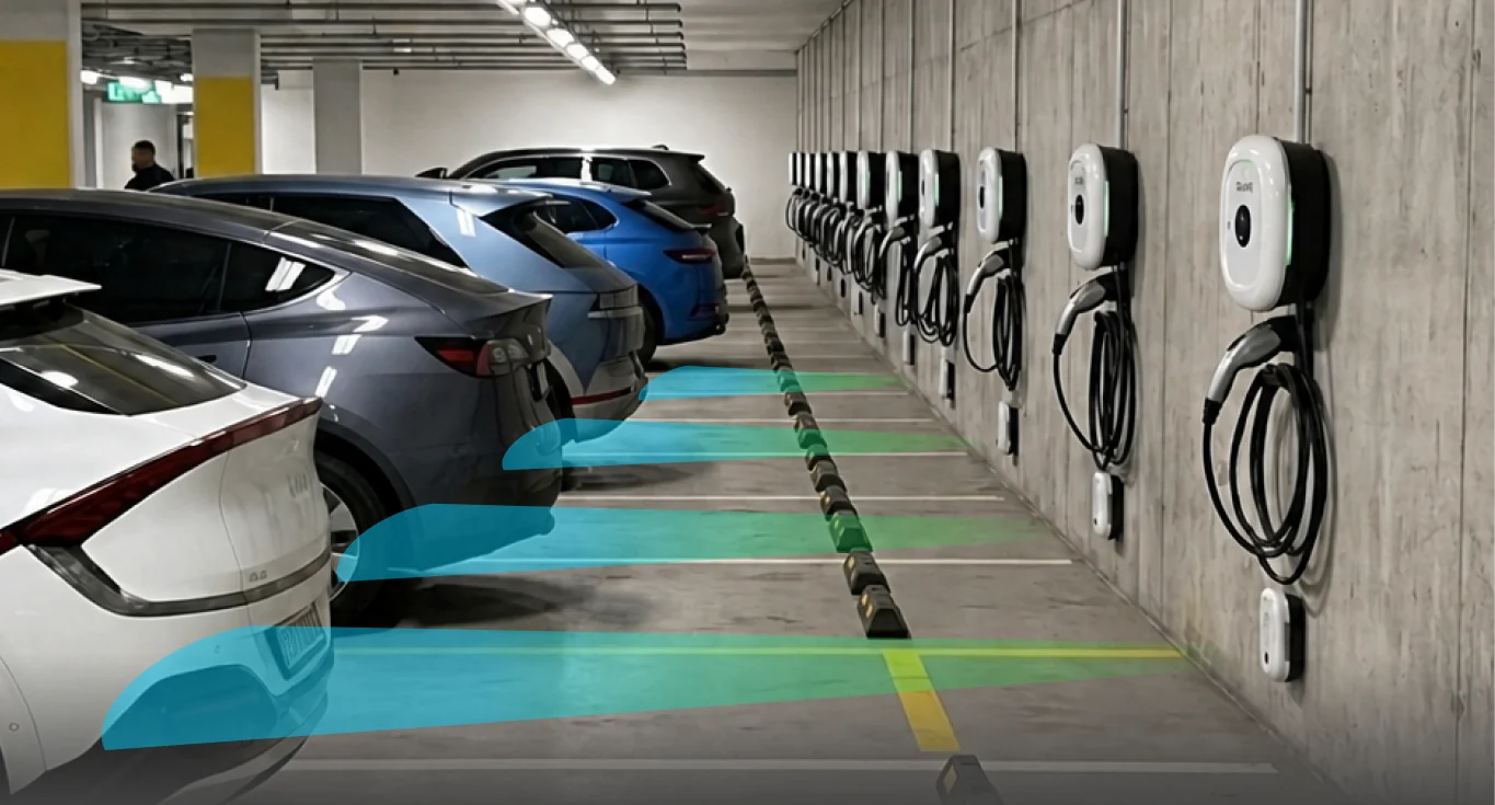 A row of EVAR chargers in an apartment basement car park, with the charging bays SAVER watches